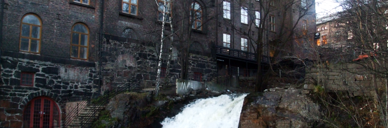 Akerselva in Oslo tumbling past factory buildings