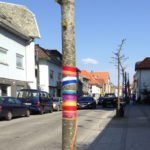 Tree trunk with ribbons