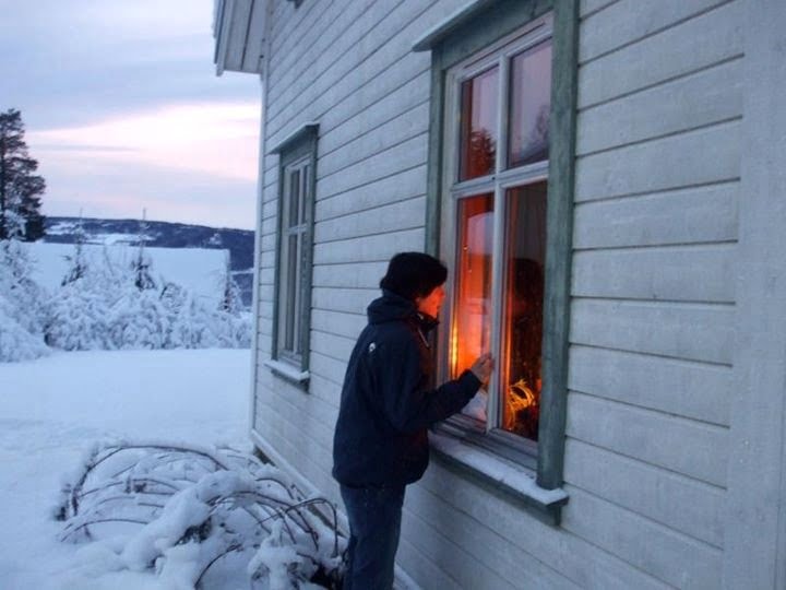 Gerry peering inside a Norwegian house exhibit