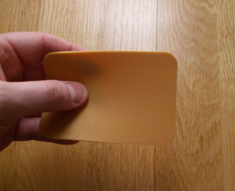 Brown cheese is the same colour as laminate flooring Slice of brown cheese compared to a wooden floor. Photo: David Nikel.
