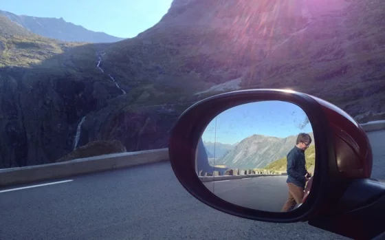 Chris in the car mirror