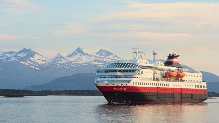 Hurtigruten coastal ferry sailing along the coast of Norway.