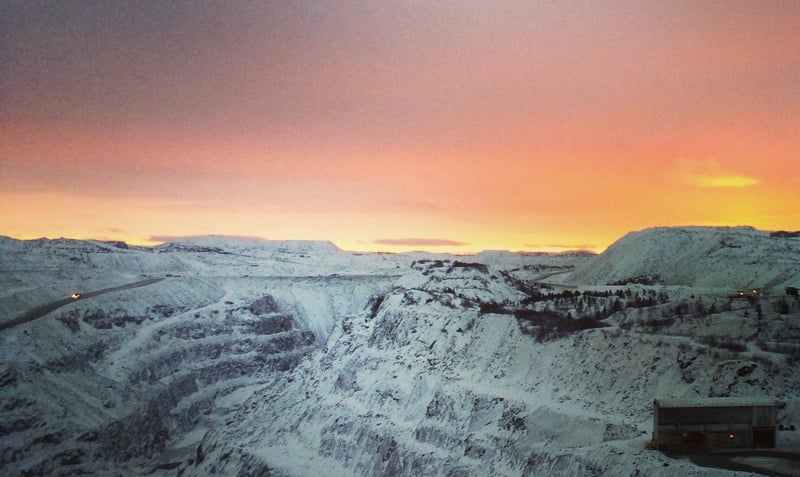 Sunset over an Arctic open mine