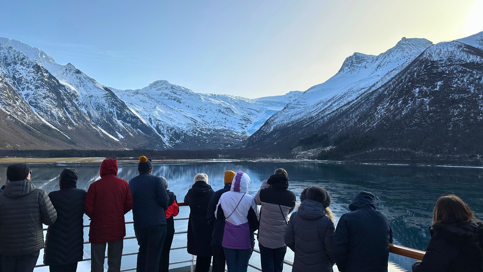 People admiring glacier in Northern Norway. Photo: David Nikel.