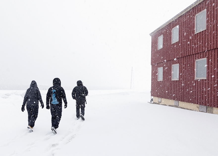 Walking through Ny-Ålesund in Svalbard