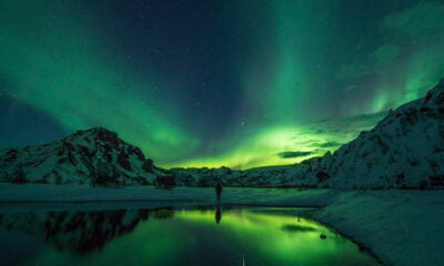 A bright green aurora borealis display in Norway