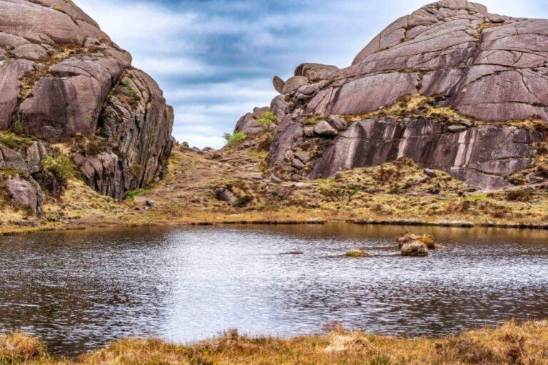 Trollpikken in context with the distinctive rocky landscape of the Magma UNESCO Global Geopark.