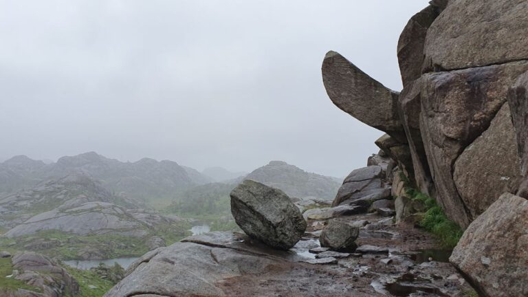 Trollpikken rock formation on a cloudy day.