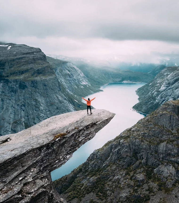 Standing on Trolltunga in Norway