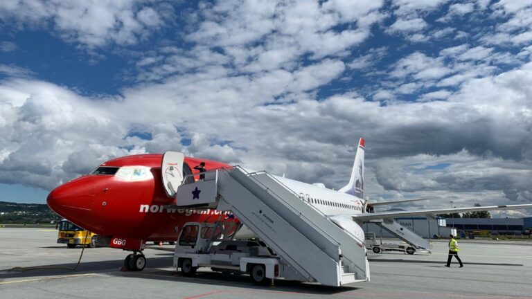 Norwegian Air plane about to begin the boarding process in Trondheim, Norway. Photo: David Nikel.