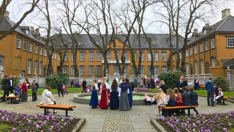 People in the courtyard of Stiftsgården, Trondheim, on Norway's National Day. Photo: David Nikel.