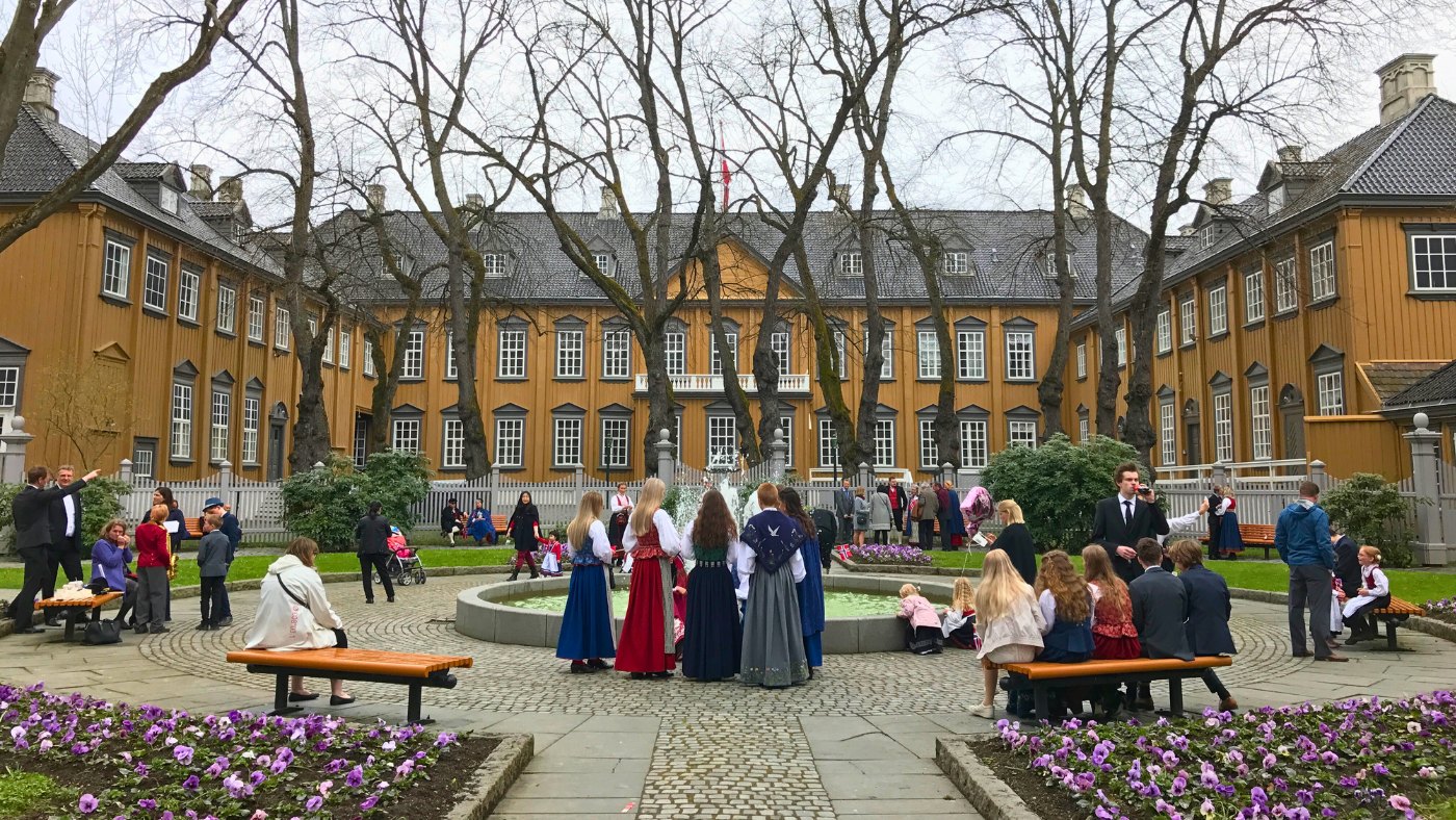 People in the courtyard of Stiftsgården, Trondheim, on Norway's National Day. Photo: David Nikel.