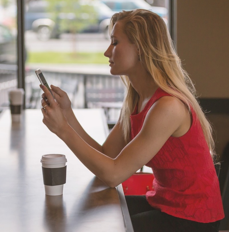 Woman using a smartphone in Norway