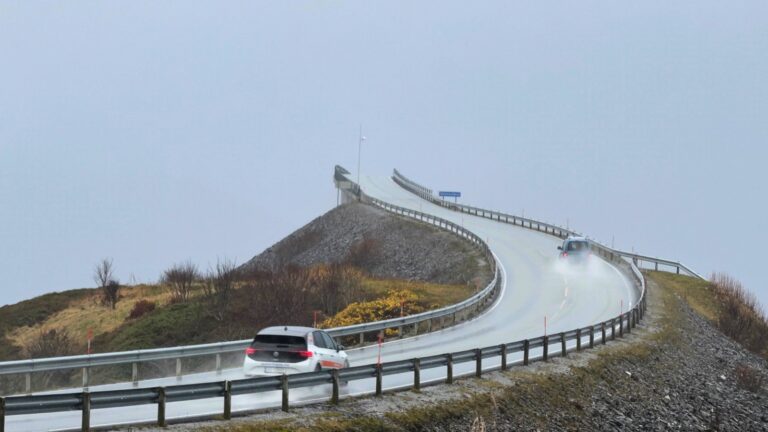 Two cars driving on Norway's Atlantic Road in wet weather. Photo: David Nikel.