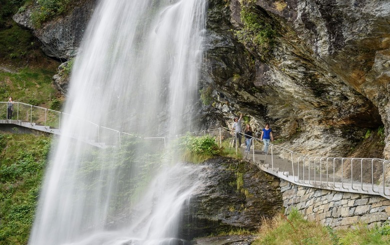 Walking under Steinsdalsfossen waterfall in Norway