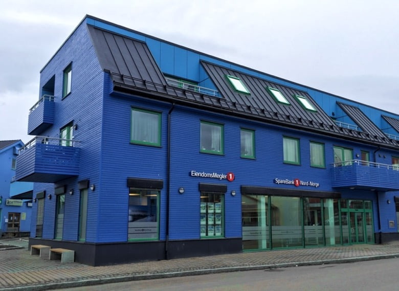 A blue bank building in Sortland, Norway