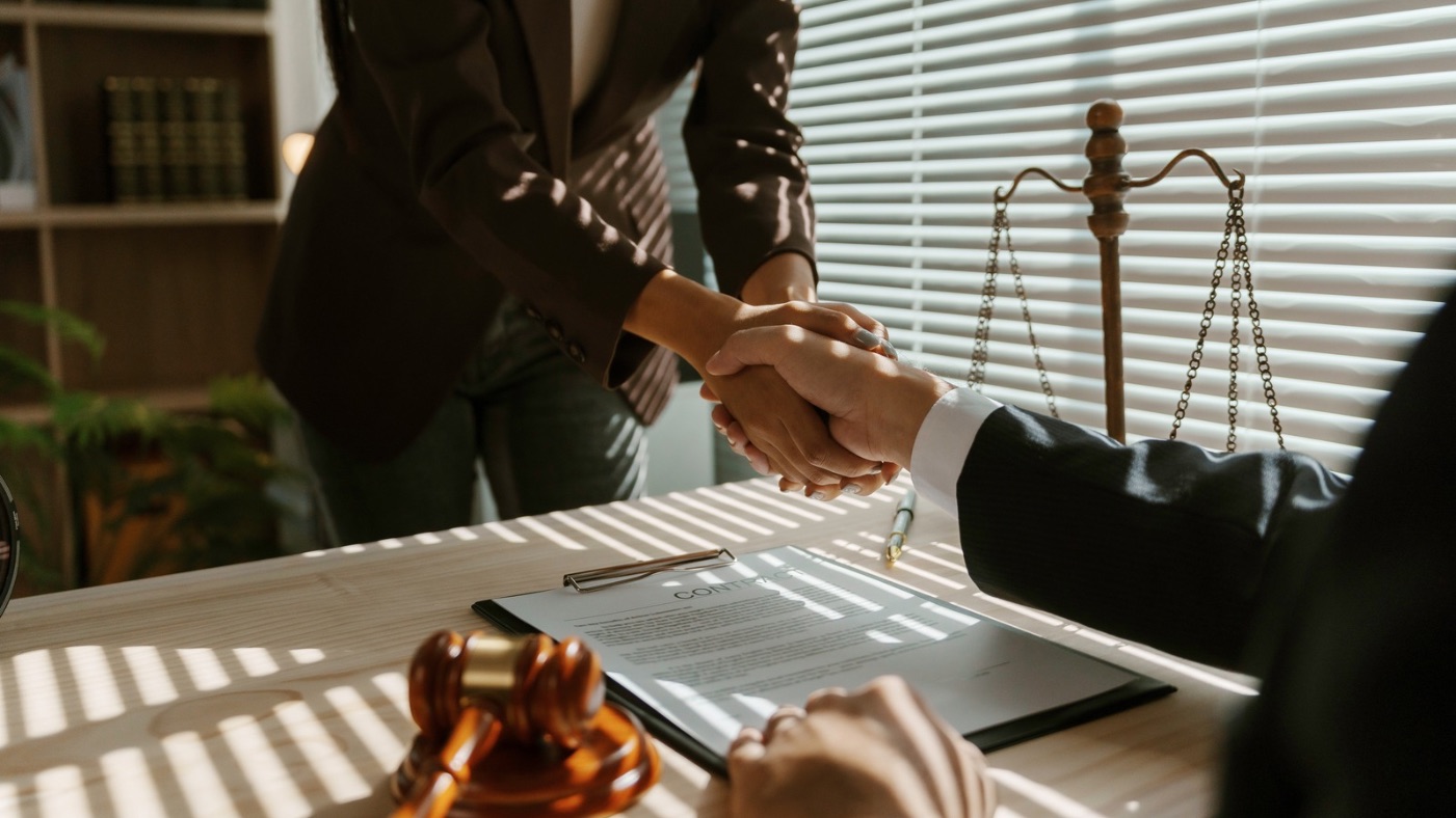 Handshake in legal office.