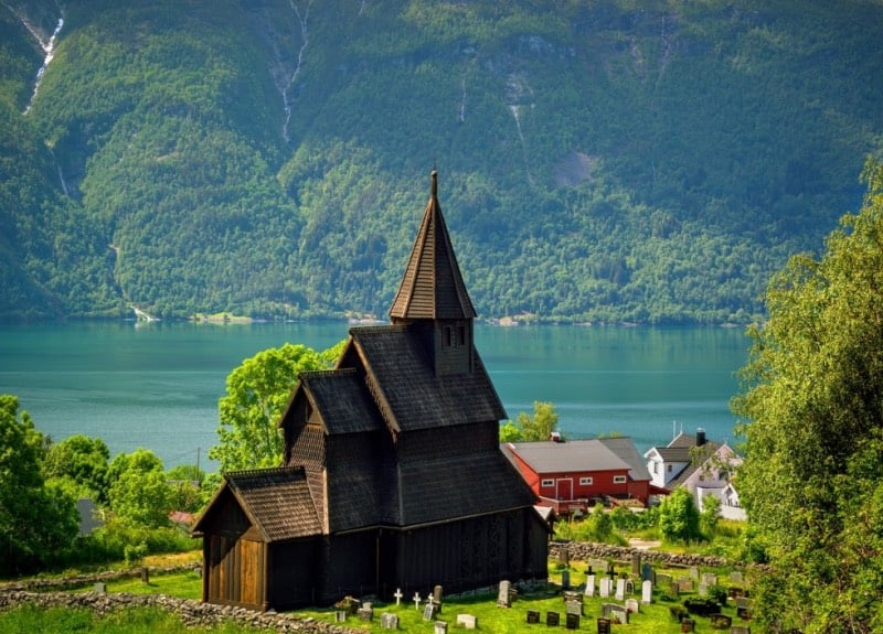 Stave churches by a Norwegian fjord