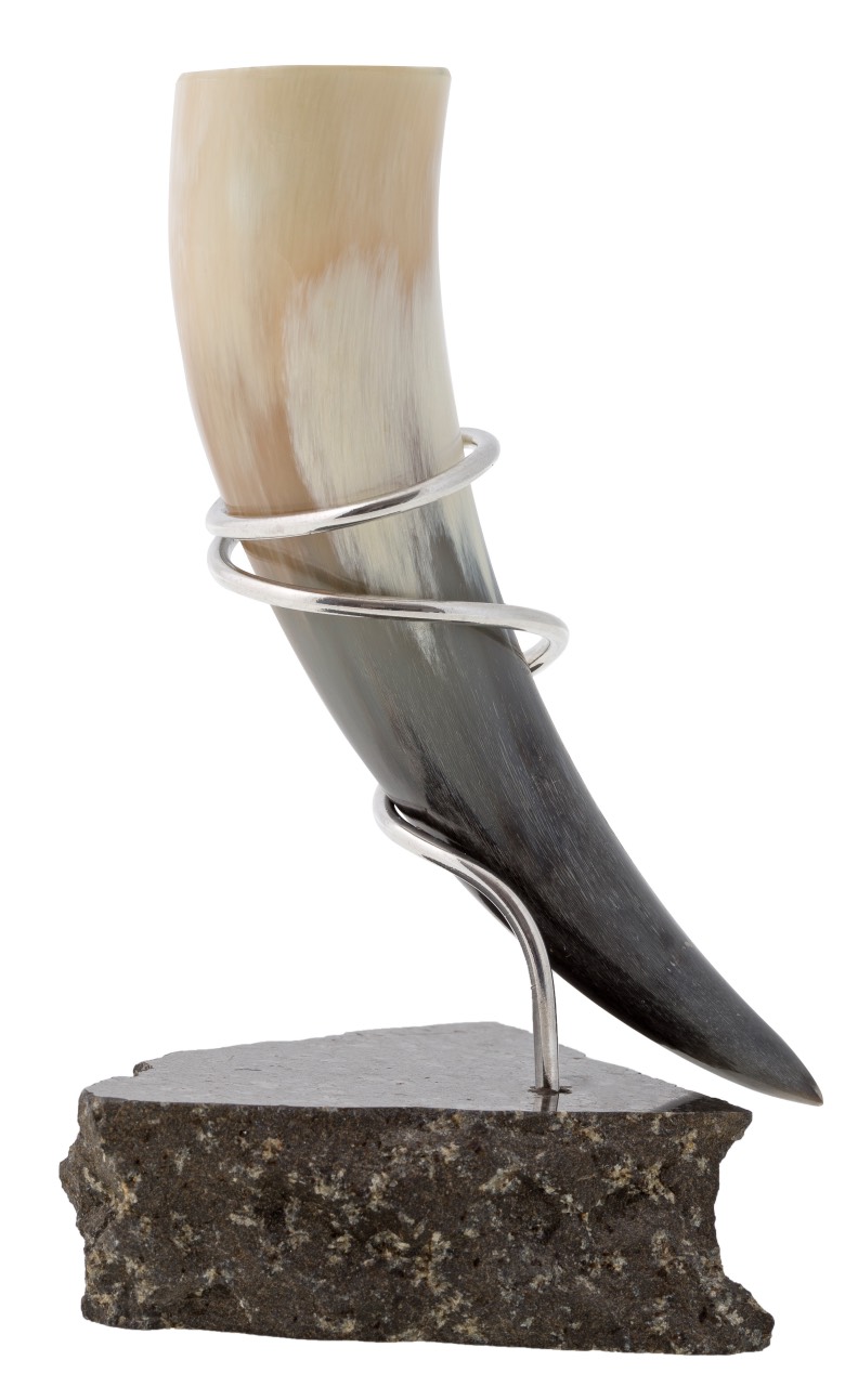 A Viking or medieval drinking horn made from a sheep's horn.