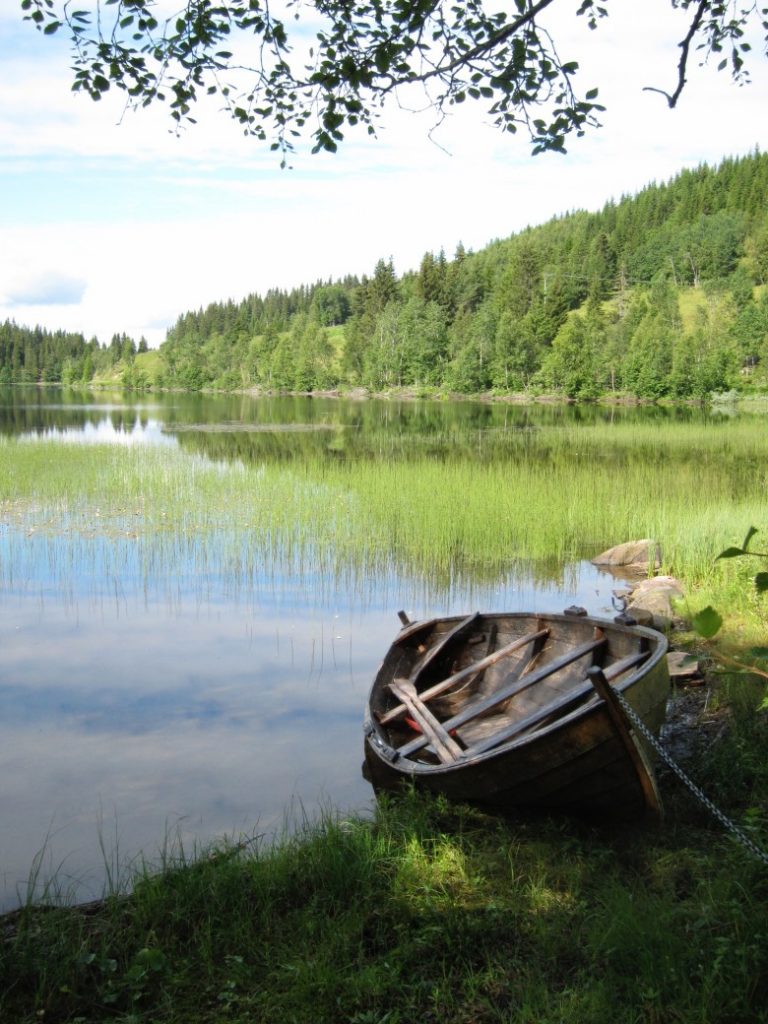 Hiking past a Norwegian lake