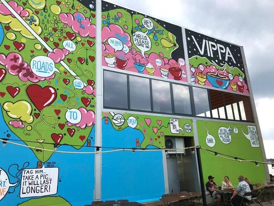 Brightly coloured murals on the exterior of Vippa, Oslo's latest food hall.