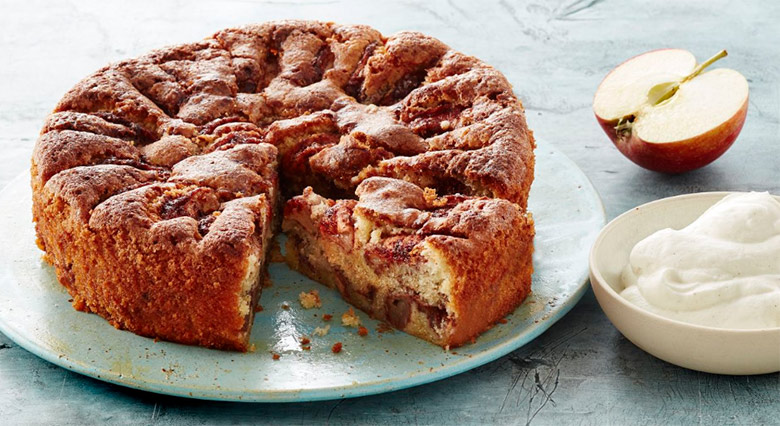 Traditional Norwegian apple cake served with cream.