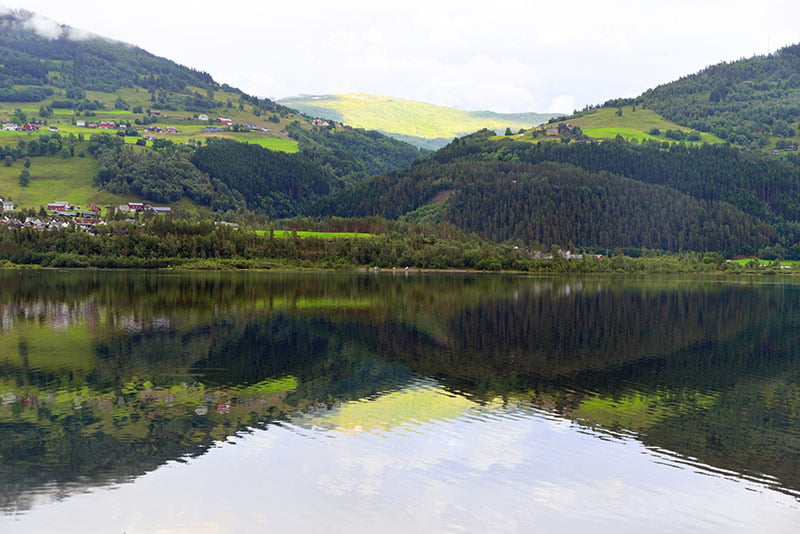 The beautiful mirror-still Lake Vangsvatnet in Norway