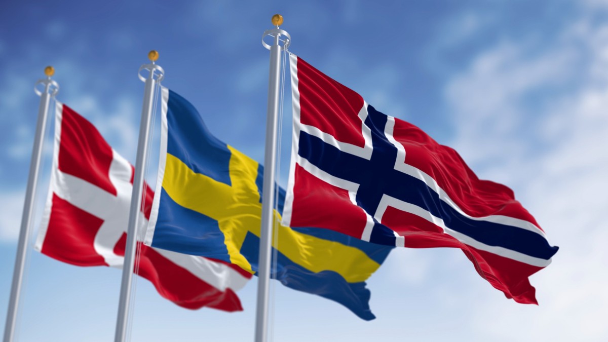 The flags of the three Scandinavian nations.
