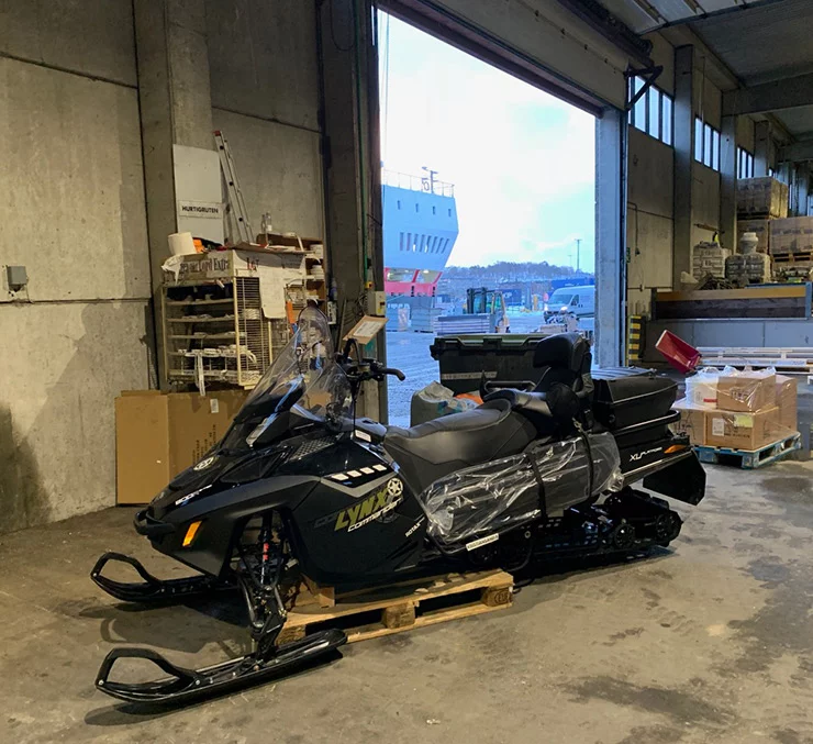A snowscooter waiting to be loaded on the Hurtigruten as cargo