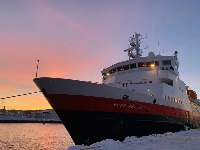 MS Vesterålen in front of a winter Trondheim sunrise