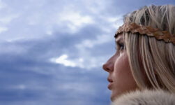 A typical blonde Norwegian women in a Viking outfit