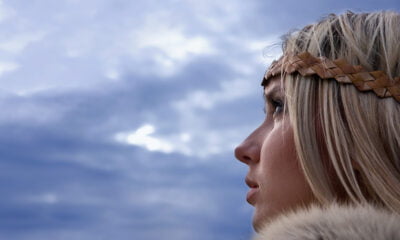 A typical blonde Norwegian women in a Viking outfit