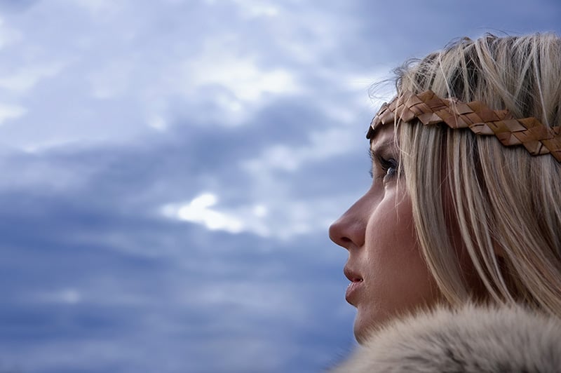 A typical blonde Norwegian women in a Viking outfit