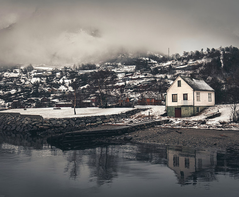 A house and clouds above the Eidfjord, Norway