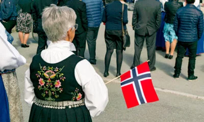 Lady in bunad with flag