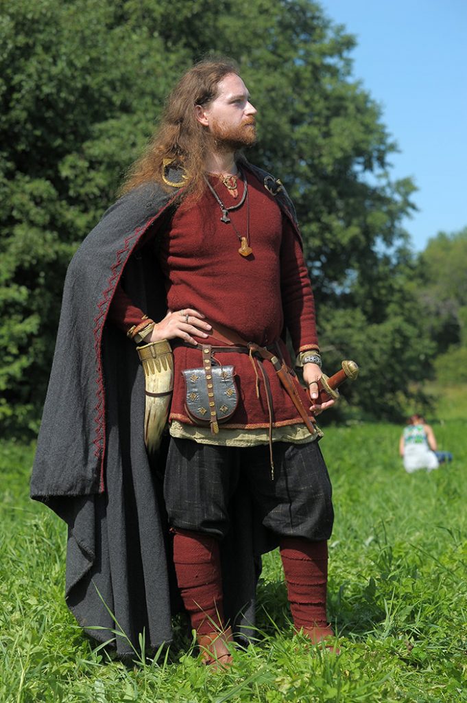 A man wearing a costume at a viking reenactment