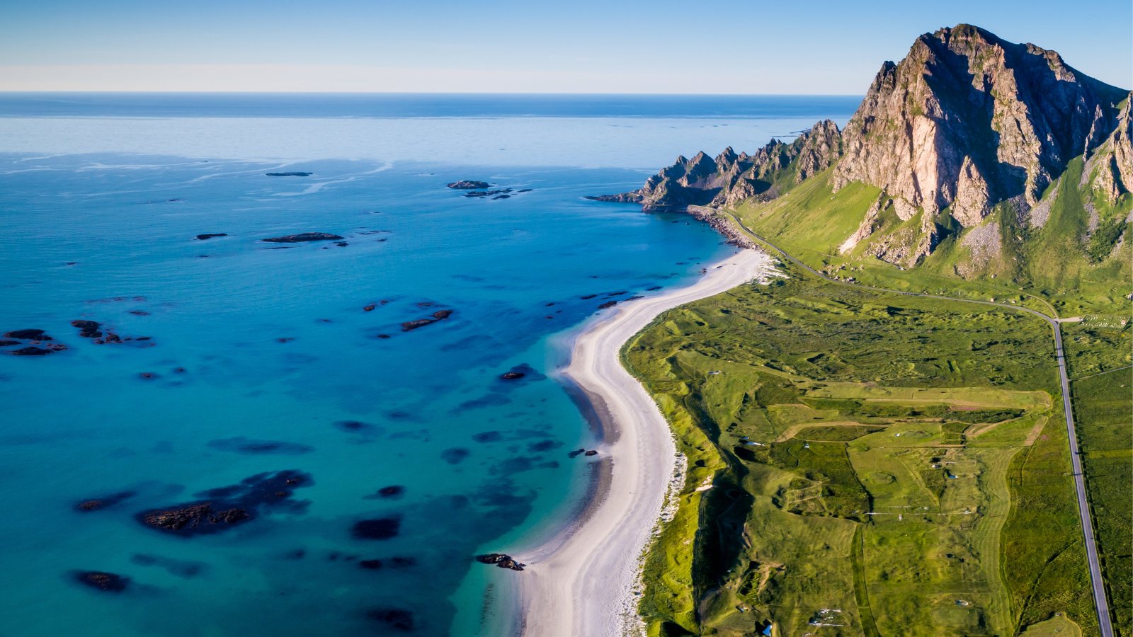 Beach and road on the coast of Andøya Island in Northern Norway.