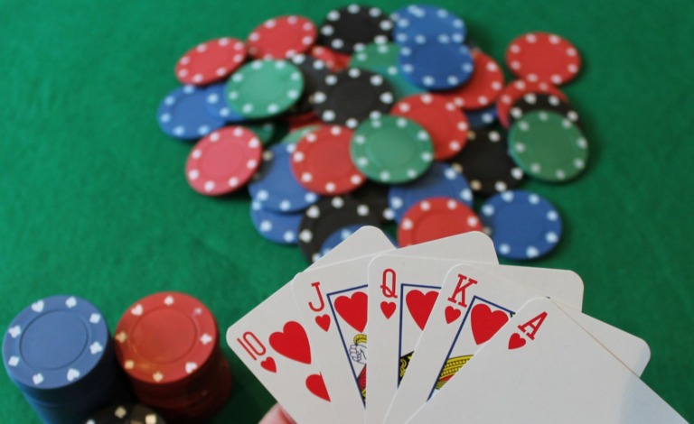 Poker cards and chips on a table.