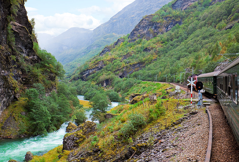 Train on a valley track in Norway