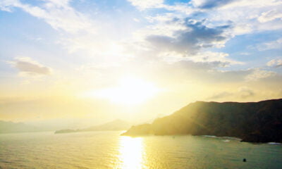 Sunshine over a mountain and fjord in a Norwegian winter