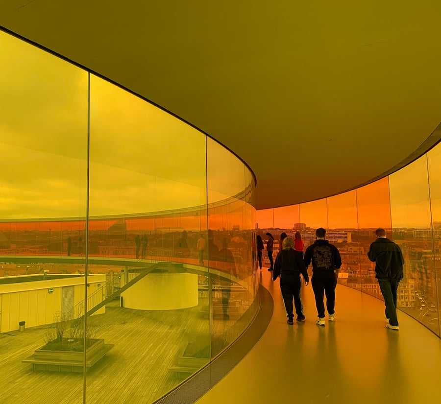 People inside the rainbow panorama skywalk in Aarhus, Denmark