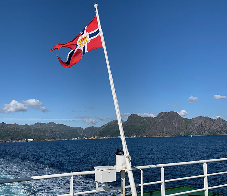 Flag on the back of the MF Røst ferry on route to Skrova