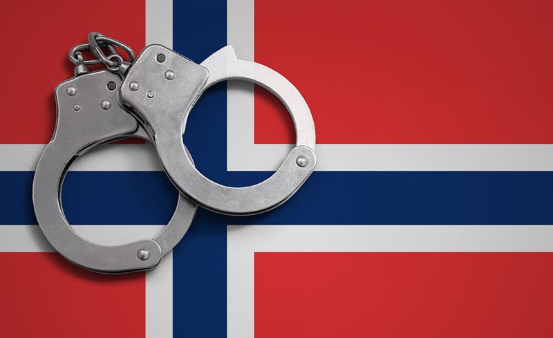 Handcuffs on the Norwegian flag
