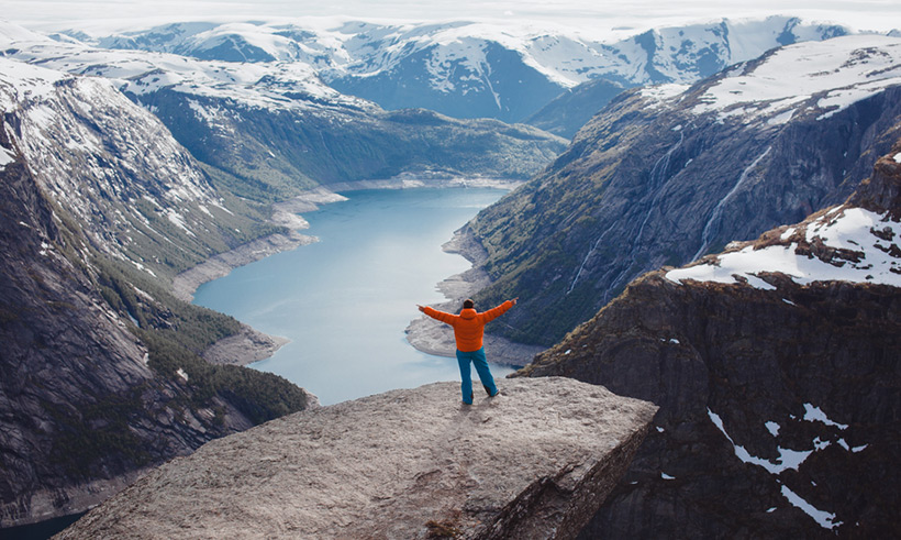 Happy man at Trolltunga in Norway