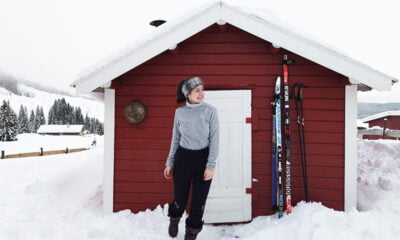 Mon Amie standing in front of a Norwegian cabin in the snow