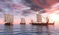 Historical Viking ships full of seafaring Norsemen