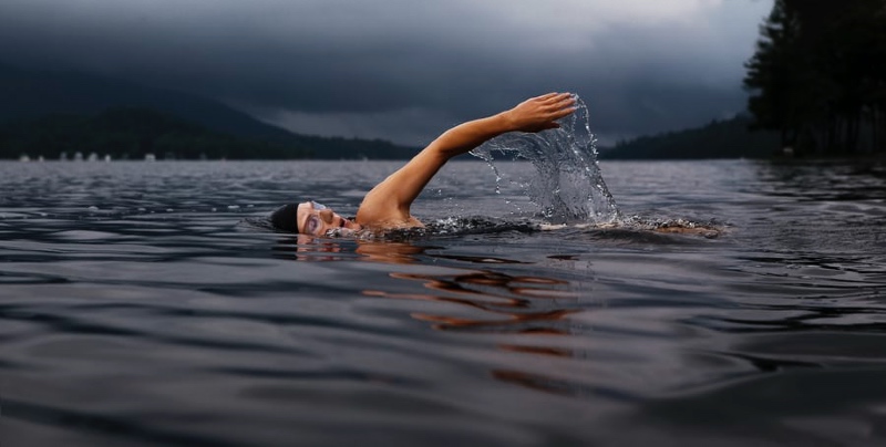 A swimmer in a Norwegian fjord