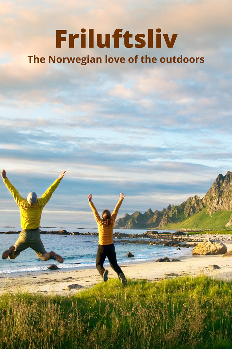 A couple jumping with happiness in the Norwegian outdoors