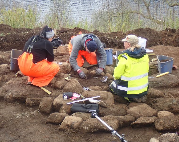 Norwegian archaeologists working on the excavation of the burial cairn in Norway