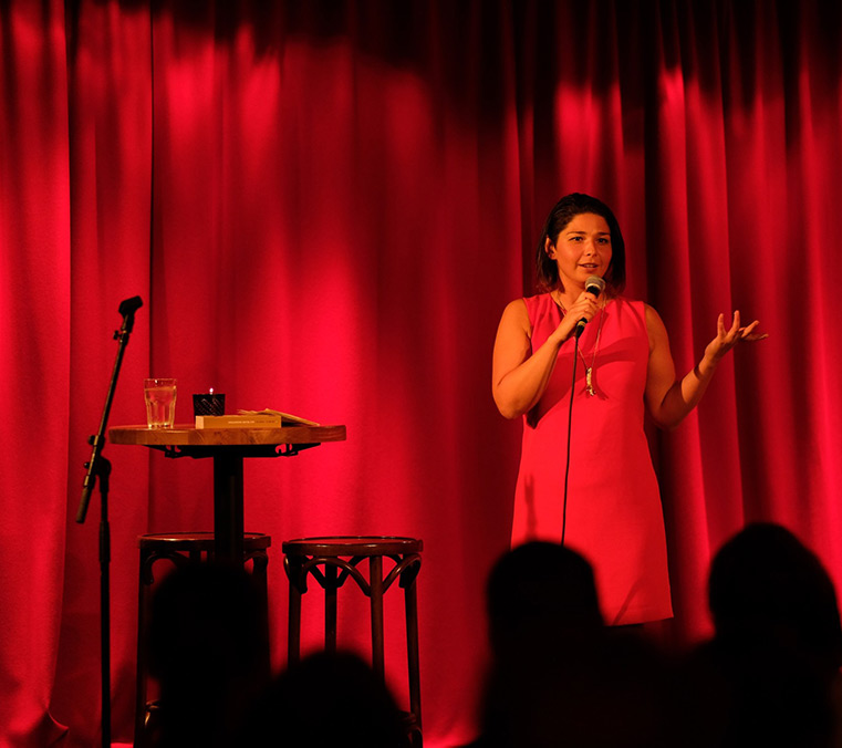 Maria Amelie giving a talk on stage